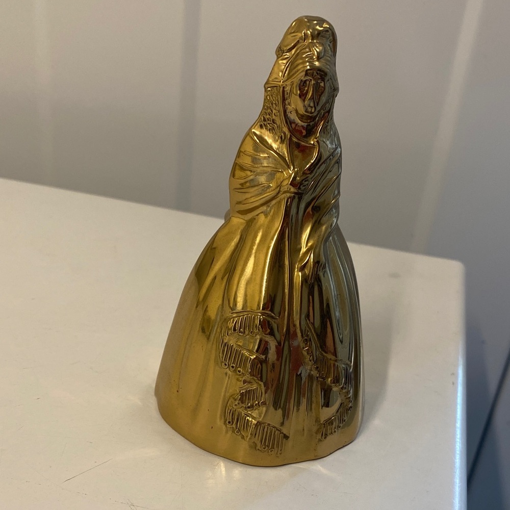 Brass bell, woman figurine,  4” tall, good used condition.